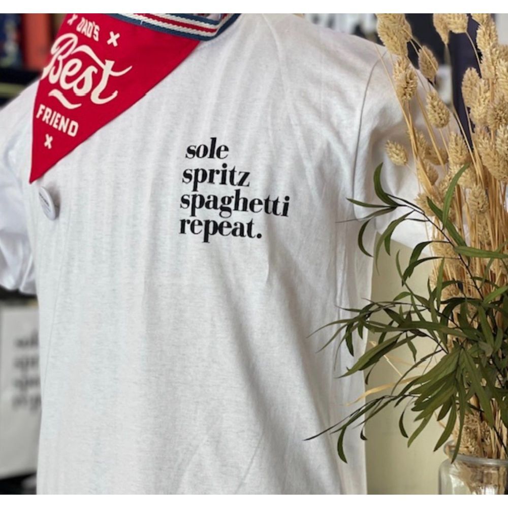 White Graphic Tee with 'Sole Spritz Spaghetti Repeat' Text